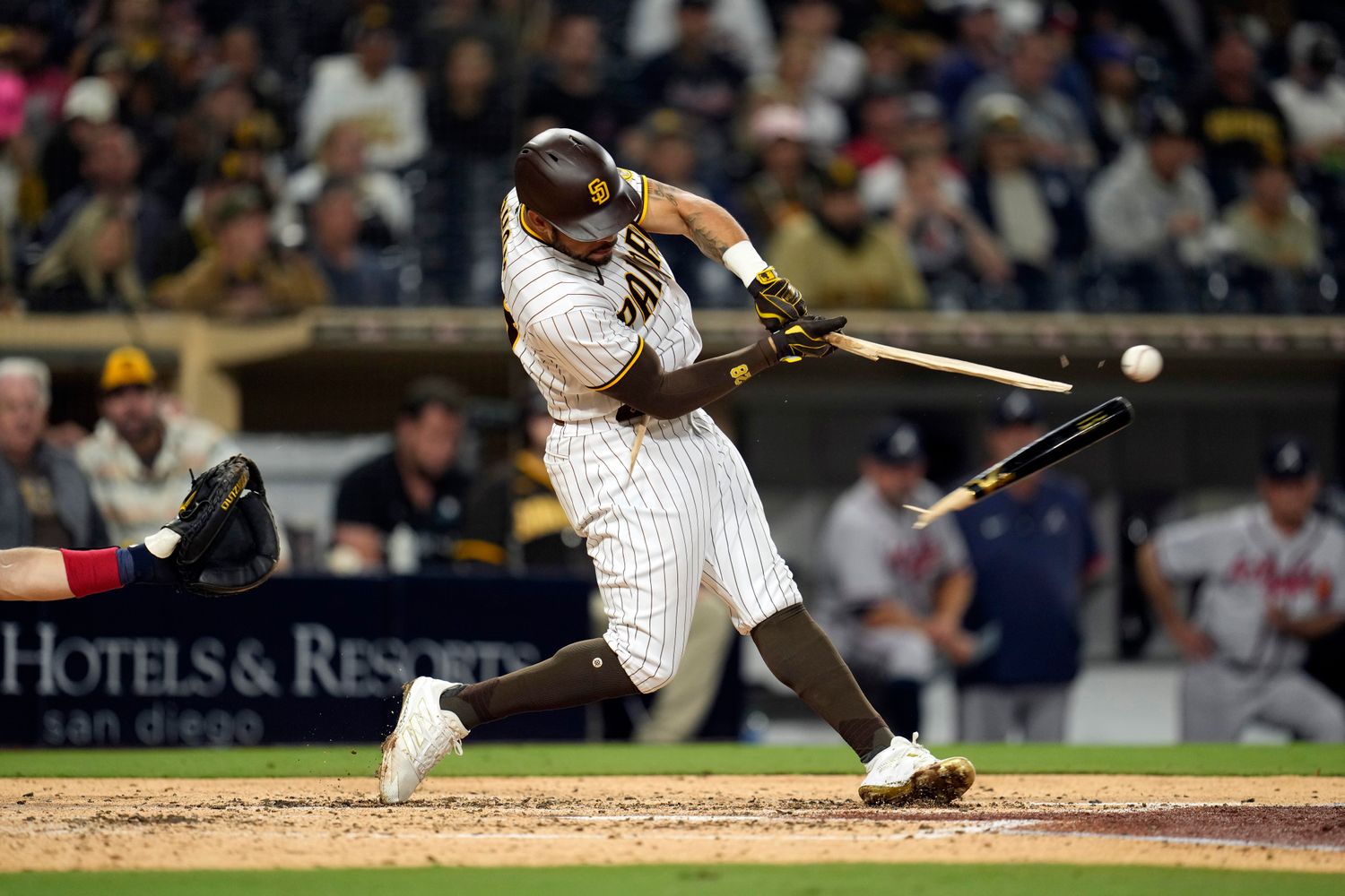 Sep 24, 2021; San Diego, CA, USA; San Diego Padres first baseman Eric Hosmer (30) breaks his bat against the Atlanta Braves during the seventh inning at Petco Park. Mandatory Credit: Ray Acevedo-USA TODAY Sports